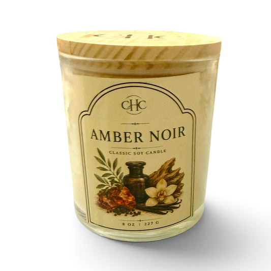 Amber Noir classic soy candle with a rich, warm amber scent, 7 oz hand-poured in a glass jar with wood lid