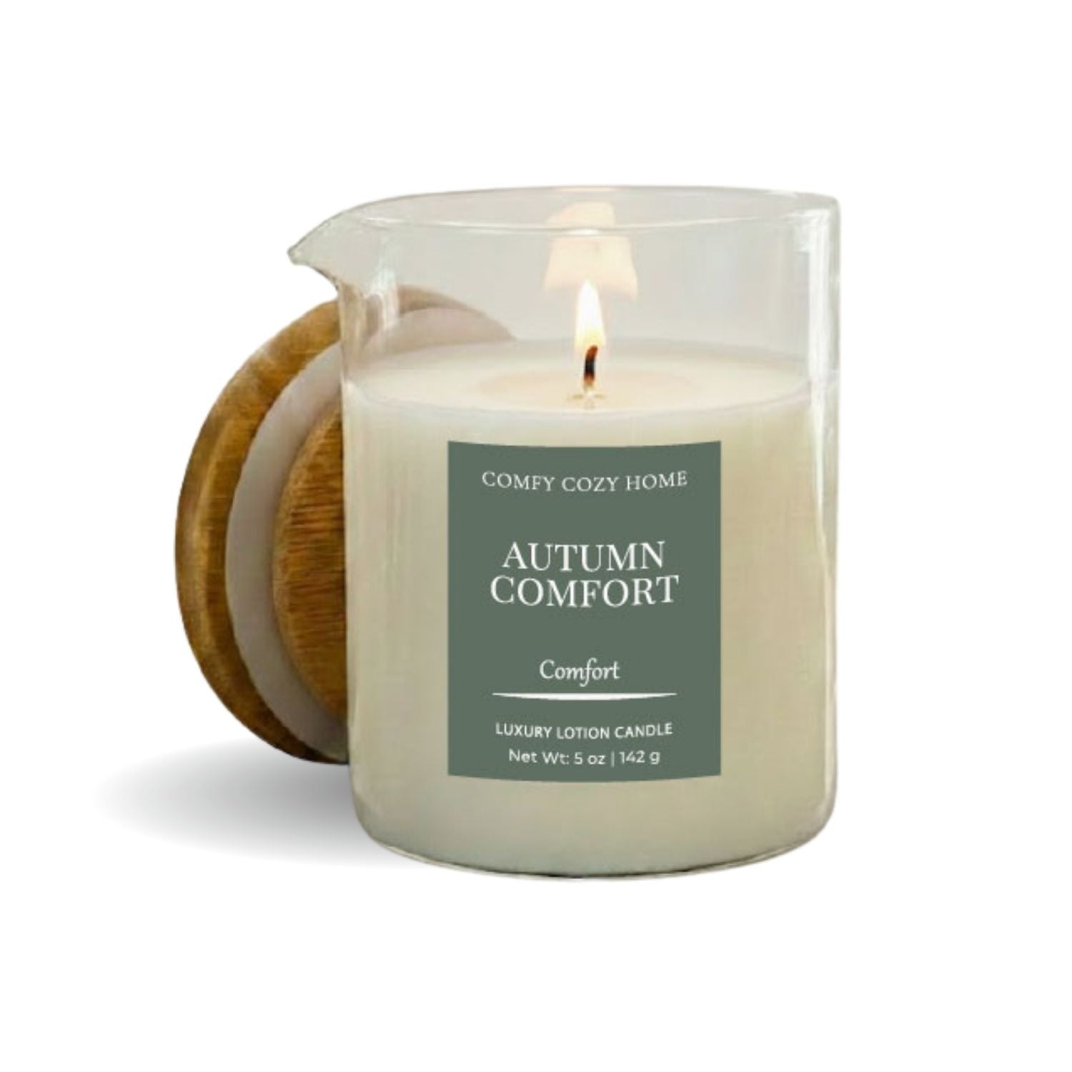 Candle labeled 'Autumn Comfort' by Comfy Cozy Home on a white background