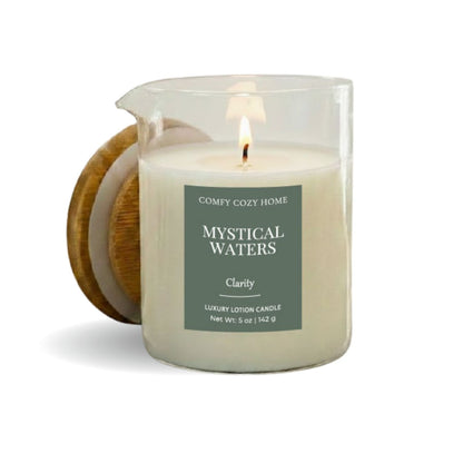 Candle labeled 'Mystical Waters' by Comfy Cozy Home on a white background