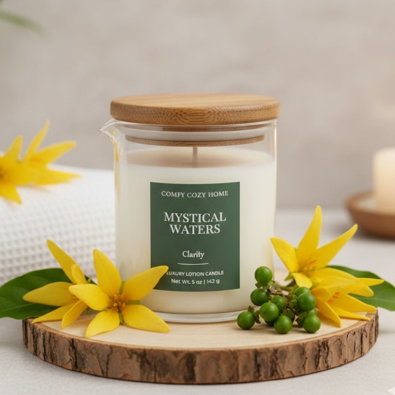 Candle labeled 'Mystical Waters' with yellow flowers on a wooden coaster