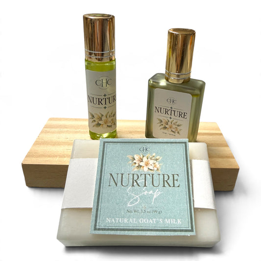 Nurture Scent Trio Gift Set in Citrus Agave: alcohol-free perfume spray, roll-on perfume and goat milk soap on a wooden soap dish