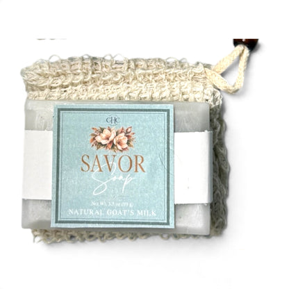 Savor goat milk soap in Amber Noir tucked in its drawstring soap bag