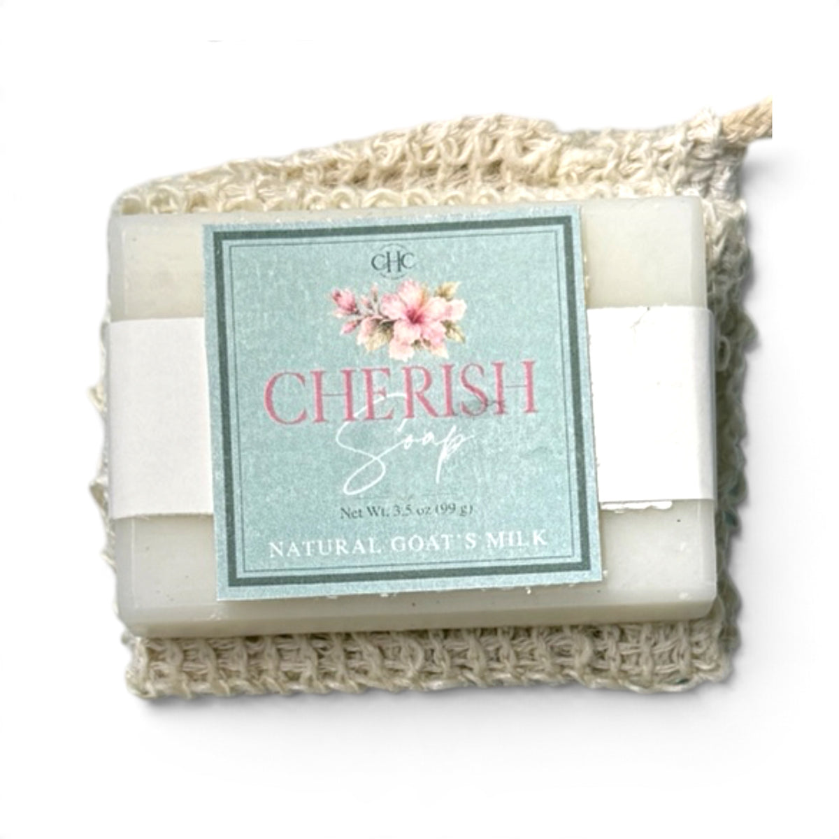 Cherish goat milk soap in Freesia & Lilac tucked in its drawstring soap bag