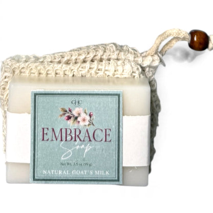 Embrace goat milk soap in Cashmere Plum tucked in its drawstring soap bag