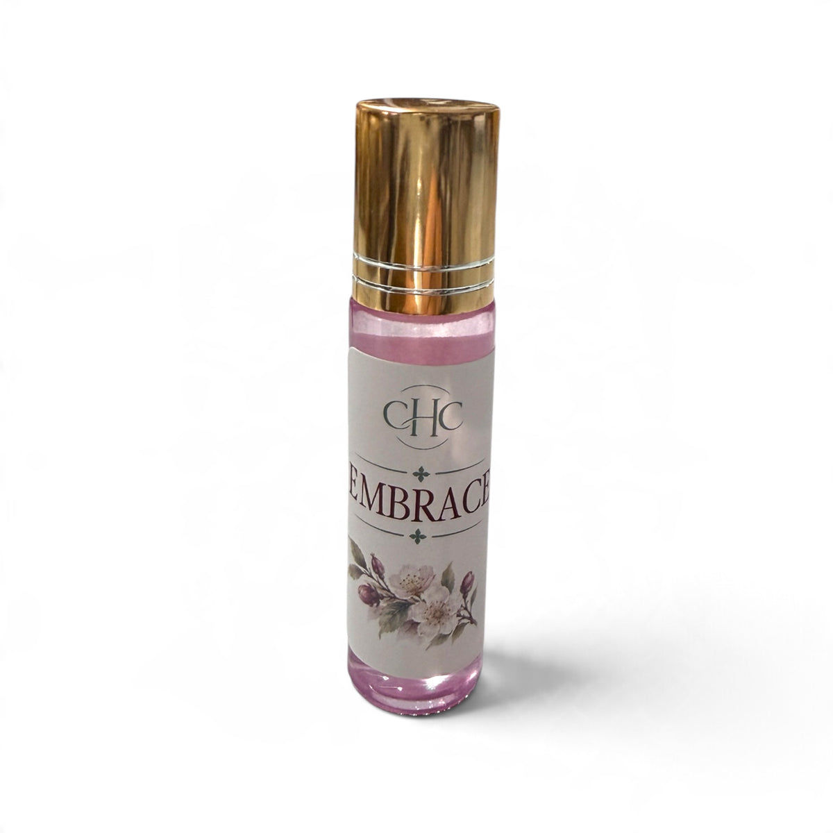 Embrace roll-on perfume in Cashmere Plum, 10 ml glass roller bottle with a gold cap